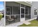 View of screened in patio with outdoor furniture and a view of the backyard at 8654 Windsor Hill Blvd, North Charleston, SC 29420