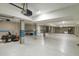Large basement featuring concrete columns, a work bench, and a ride-on lawn mower at 1 Bay Ct, Isle of Palms, SC 29451