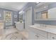 Bathroom featuring a double vanity, tiled floors, and a large mirror at 1 Bay Ct, Isle of Palms, SC 29451