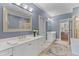 Bright bathroom featuring double vanities, tiled floors, and neutral paint at 1 Bay Ct, Isle of Palms, SC 29451