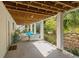 A covered outdoor space featuring an outdoor seating area with multiple sofas, chairs, and plant life at 1 Bay Ct, Isle of Palms, SC 29451