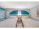 Bedroom featuring two beds, soft lighting, and a stylish design at 1004 Ocean Blvd # 108, Isle of Palms, SC 29451