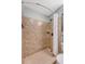 Shower with tiled walls and shower curtain at 1004 Ocean Blvd # 108, Isle of Palms, SC 29451