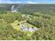 Breathtaking aerial view of a home with landscaped grounds and a long driveway at 1019 Spiers Cir, Bonneau, SC 29431