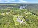 Stunning aerial view of a home nestled among lush trees with long driveway at 1019 Spiers Cir, Bonneau, SC 29431