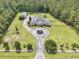 A sprawling estate showcasing lush landscaping, equestrian features, and a private, secluded setting at 1019 Spiers Cir, Bonneau, SC 29431