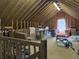 Open attic with wooden beams and ample storage space at 1019 Spiers Cir, Bonneau, SC 29431
