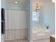 Bathroom with tub, shower and chandelier at 1019 Spiers Cir, Bonneau, SC 29431