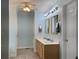 Bathroom featuring a double vanity, soft blue walls, and neutral accents at 1019 Spiers Cir, Bonneau, SC 29431