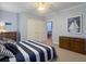 Bedroom with wood furniture and light walls at 1019 Spiers Cir, Bonneau, SC 29431