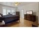 Bedroom features natural light, hardwood floors, and a ceiling fan at 1019 Spiers Cir, Bonneau, SC 29431