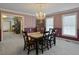 Bright dining area featuring a modern chandelier and large windows for natural light at 1019 Spiers Cir, Bonneau, SC 29431