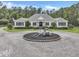 Beautiful single-story home with a circular driveway and manicured landscaping on a lush green lot at 1019 Spiers Cir, Bonneau, SC 29431
