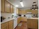 Spacious kitchen with wooden cabinets, white countertops and modern appliances at 1019 Spiers Cir, Bonneau, SC 29431