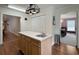 Kitchen island featuring a sink and cabinetry with easy access to the dining area at 1019 Spiers Cir, Bonneau, SC 29431
