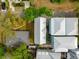 Bird's eye view reveals the property's layout and lush greenery, providing privacy at 104 May Ln, Mount Pleasant, SC 29464