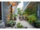 Charming back patio with brick pavers, lush greenery, and outdoor seating for relaxed living at 104 May Ln, Mount Pleasant, SC 29464