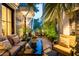 Charming back patio with brick pavers, lush greenery, and outdoor seating for relaxed living at 104 May Ln, Mount Pleasant, SC 29464