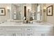Bathroom featuring dual sinks, marble countertop, and stylish lighting, creating a serene atmosphere at 104 May Ln, Mount Pleasant, SC 29464