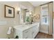 Elegant bathroom featuring a marble countertop, dual sinks, and stylish decor for a luxurious feel at 104 May Ln, Mount Pleasant, SC 29464