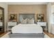 Bedroom featuring a comfortable bed with two side tables, lamps, and stylish decor at 104 May Ln, Mount Pleasant, SC 29464