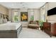 Relaxing bedroom with a comfortable bed, a cozy chair, and soft natural light at 104 May Ln, Mount Pleasant, SC 29464