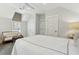 Bright bedroom with ceiling fan, window coverings and sitting area at 104 May Ln, Mount Pleasant, SC 29464