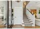Grand foyer with staircase and decorative accents at 104 May Ln, Mount Pleasant, SC 29464