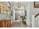 Elegant entryway with a wooden chandelier, stairway, and an open floor plan at 104 May Ln, Mount Pleasant, SC 29464