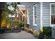 Charming home featuring a well-manicured lawn, exterior lighting, and beautiful landscaping at 104 May Ln, Mount Pleasant, SC 29464