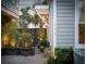 Home featuring classic architecture, exterior lighting, beautiful landscaping and a brick paved driveway at 104 May Ln, Mount Pleasant, SC 29464