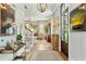 Inviting foyer featuring hardwood floors, decorative lighting and decor and an elegant staircase at 104 May Ln, Mount Pleasant, SC 29464