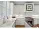 Bright kitchen features white cabinetry, stainless steel appliances, and a marble countertop at 104 May Ln, Mount Pleasant, SC 29464