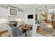 Eat-in kitchen with stainless steel appliances and views into the beautifully decorated living room at 104 May Ln, Mount Pleasant, SC 29464