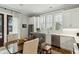 Well lit kitchen with stainless appliances, white cabinets, and a breakfast nook at 104 May Ln, Mount Pleasant, SC 29464