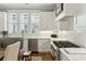 Bright kitchen with white cabinets, stainless steel appliances, and marble countertops at 104 May Ln, Mount Pleasant, SC 29464