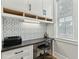 Bright office with built-in storage and geometric backsplash at 104 May Ln, Mount Pleasant, SC 29464