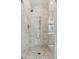 Shower showcases luxurious marble, rainfall shower head, and seamless glass for a spa-like experience at 104 May Ln, Mount Pleasant, SC 29464