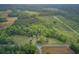 Panoramic aerial view showcasing a home, open land, and dense woodland with trails and nature at 1050 Mt Zion Rd, Saint George, SC 29477
