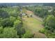 An aerial view of a house with a vast lawn surrounded by lush green trees at 1050 Mt Zion Rd, Saint George, SC 29477