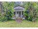 Charming home featuring a welcoming front porch, lush landscaping, and a quaint, inviting entrance at 1050 Mt Zion Rd, Saint George, SC 29477
