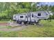 Well-maintained RV with a cozy outdoor seating area for enjoying peaceful moments in nature at 1050 Mt Zion Rd, Saint George, SC 29477