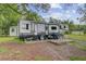 Comfortable RV with an outdoor dining area perfect for relaxing and enjoying the outdoors at 1050 Mt Zion Rd, Saint George, SC 29477