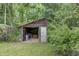 Rustic wooden shed with an open front provides ample storage space for tools and equipment at 1050 Mt Zion Rd, Saint George, SC 29477