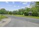 Quaint home with lush landscaping, a well-maintained lawn, and a peaceful, rural setting on a quiet street at 1050 Mt Zion Rd, Saint George, SC 29477