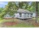 Back exterior view of home with access to the sliding glass door leading to the wooden deck at 106 Chaff Ct, Summerville, SC 29485