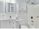 Bright bathroom with white tile, vanity, and shower-tub combination featuring bronze fixtures at 106 Chaff Ct, Summerville, SC 29485