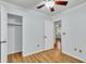 Light-filled bedroom with hardwood floors and ceiling fan, complemented by closet and ensuite bathroom at 106 Chaff Ct, Summerville, SC 29485