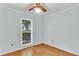 Comfortable bedroom with hardwood floors, ceiling fan, and a bright window offering a pleasant view at 106 Chaff Ct, Summerville, SC 29485