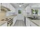 Bright kitchen with tiled floors and standard appliances, plus a view to the back yard at 106 Chaff Ct, Summerville, SC 29485